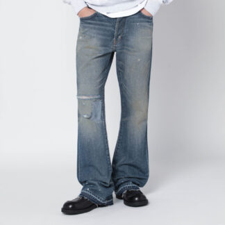 Faded indigo jeans with rips