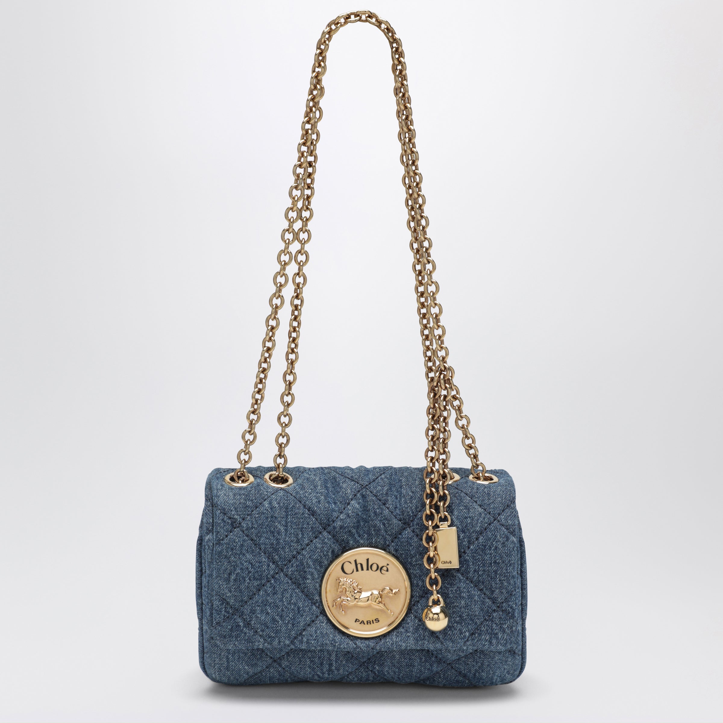Heritage small quilted denim shoulder bag in blue